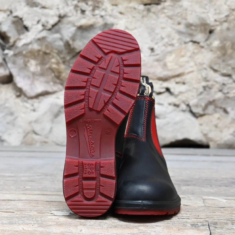 Blundstone Slip On In Black Premium Leather With Red Elastic And Red Outsole.